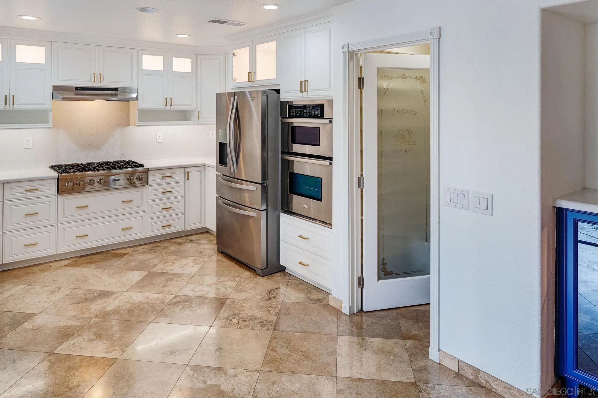4318 Meadow Spring Way Oceanside, CA 92057 - Photo 11 of 50 a kitchen with stainless steel appliances a refrigerator sink and cabinets