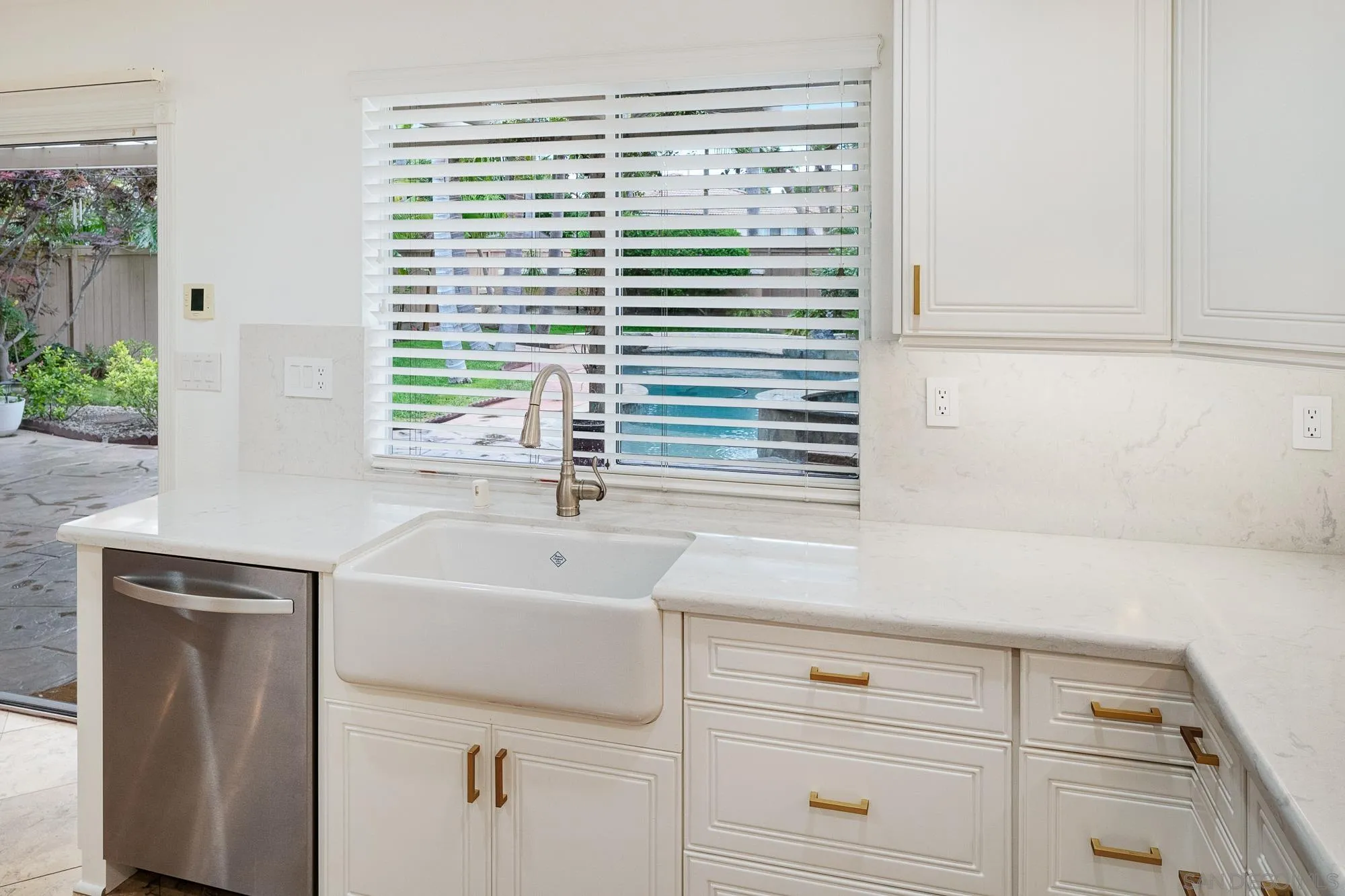 4318 Meadow Spring Way Oceanside, CA 92057 - Photo 14 of 50 a view of a sink and a window in an empty room