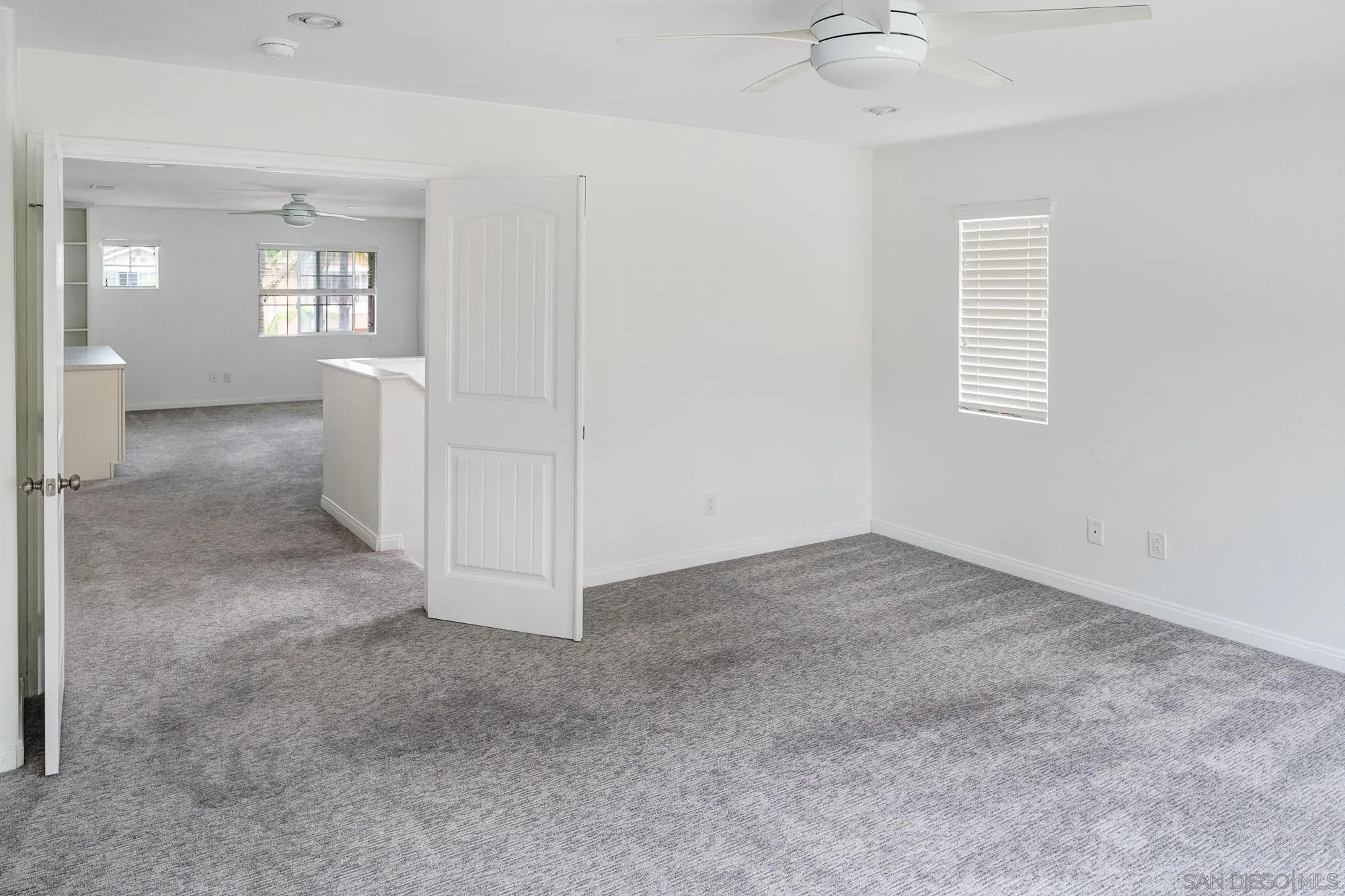 4318 Meadow Spring Way Oceanside, CA 92057 - Photo 27 of 50 an empty room with windows and entrance