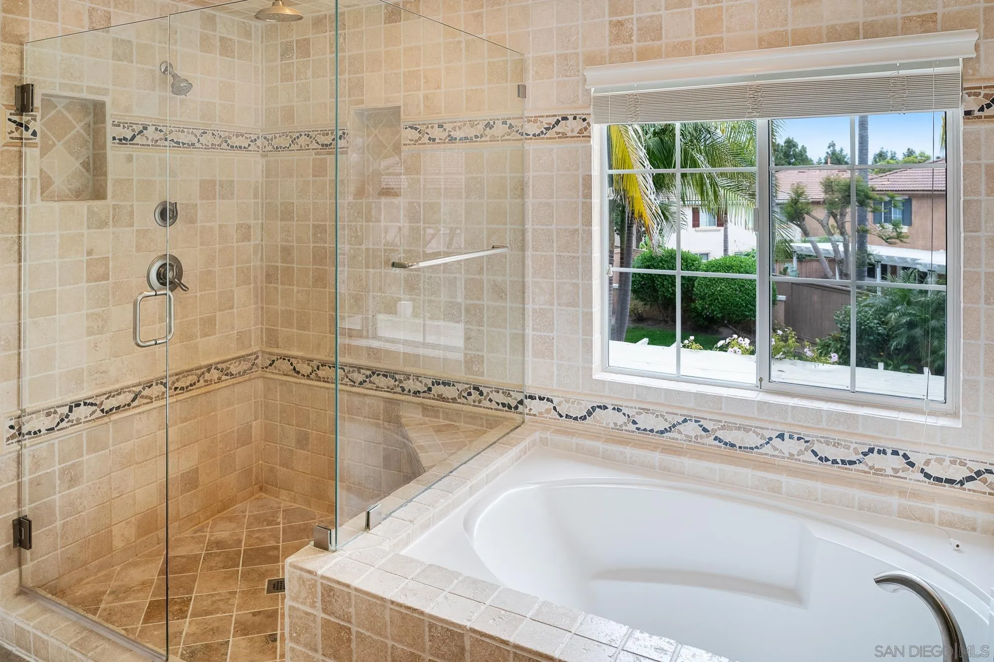 4318 Meadow Spring Way Oceanside, CA 92057 - Photo 29 of 50 a bathroom with a tub and shower