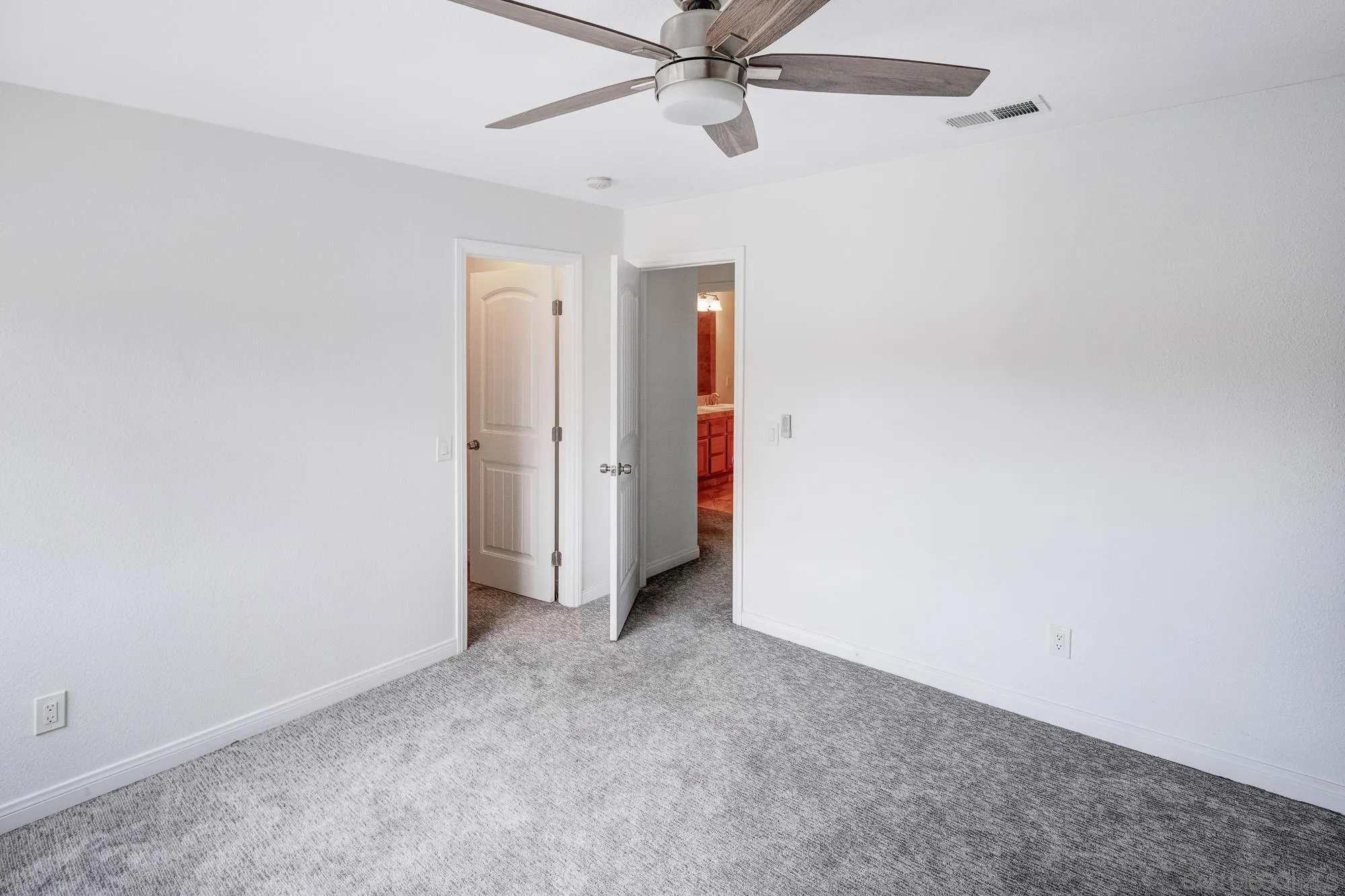 4318 Meadow Spring Way Oceanside, CA 92057 - Photo 39 of 50 an empty room with closet and fan