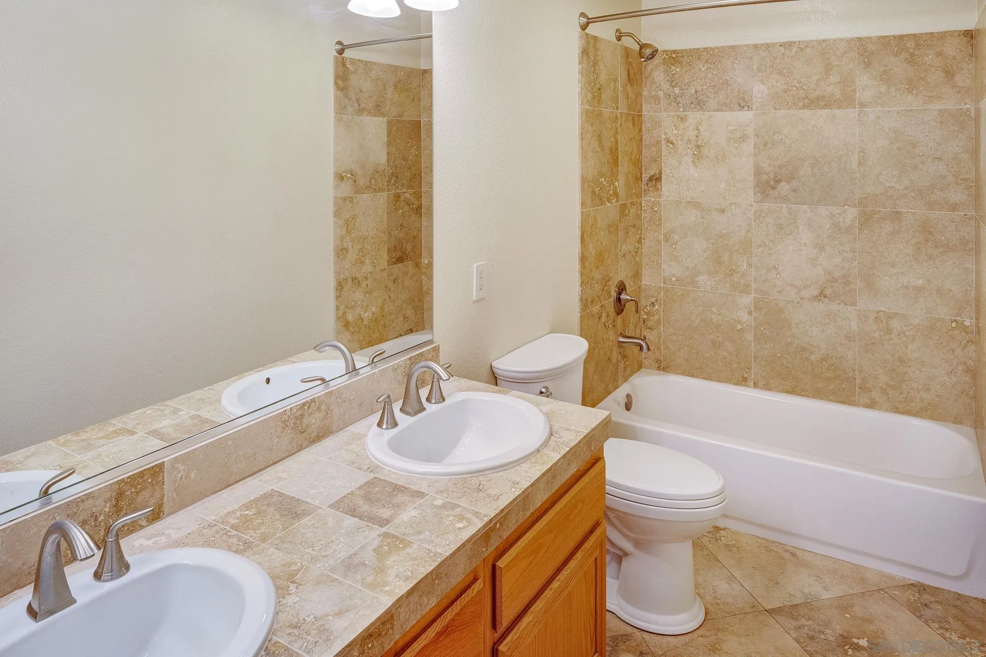 4318 Meadow Spring Way Oceanside, CA 92057 - Photo 42 of 50 a bathroom with a granite countertop sink and a mirror