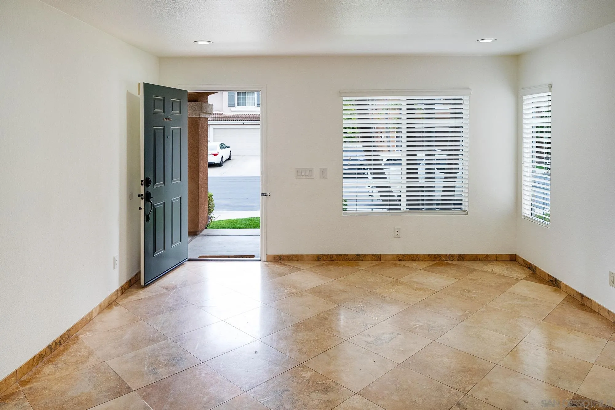 4318 Meadow Spring Way Oceanside, CA 92057 - Photo 5 of 50 a view of an empty room with a window