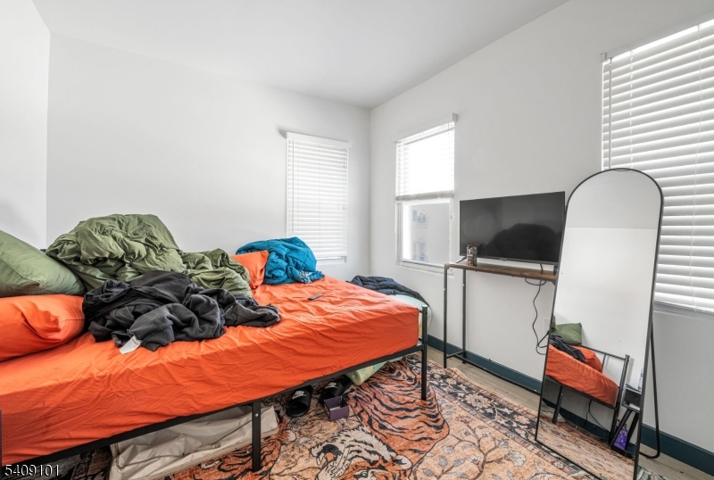 17 Mission Street Montclair, NJ 07042 - Photo 23 of 35 a bed room with a bed and a television