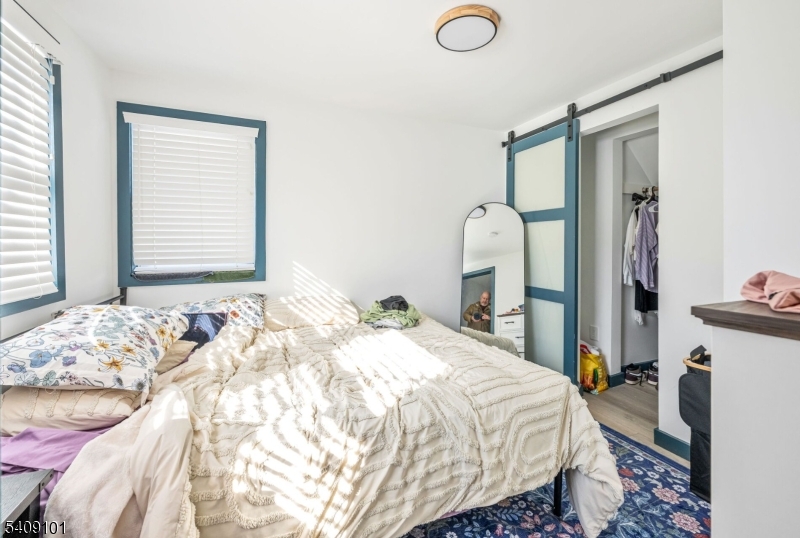 17 Mission Street Montclair, NJ 07042 - Photo 26 of 35 a bedroom with a bed and a mirror