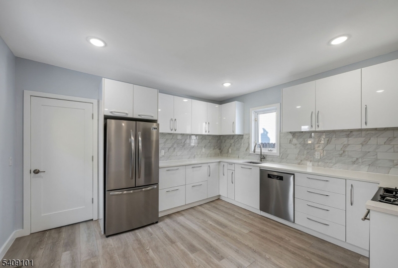 17 Mission Street Montclair, NJ 07042 - Photo 3 of 35 a kitchen with a refrigerator sink and cabinets