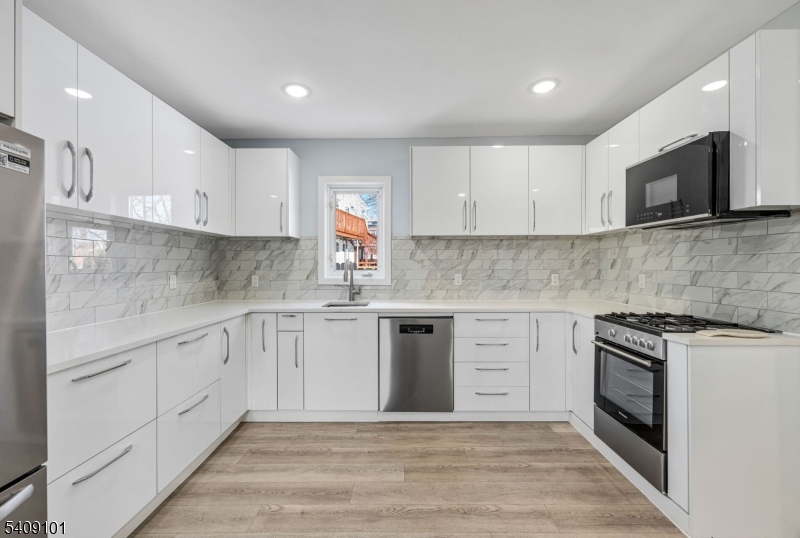17 Mission Street Montclair, NJ 07042 - Photo 4 of 35 a kitchen with cabinets stainless steel appliances and sink