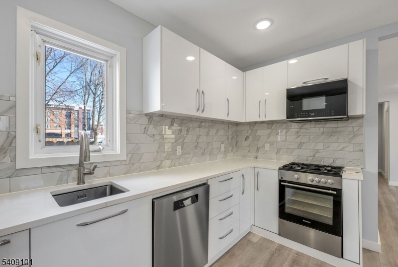 17 Mission Street Montclair, NJ 07042 - Photo 5 of 35 a kitchen with a sink stove and microwave