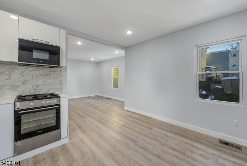 17 Mission Street Montclair, NJ 07042 - Photo 6 of 35 a view of a kitchen with a stove cabinets and a wooden floor