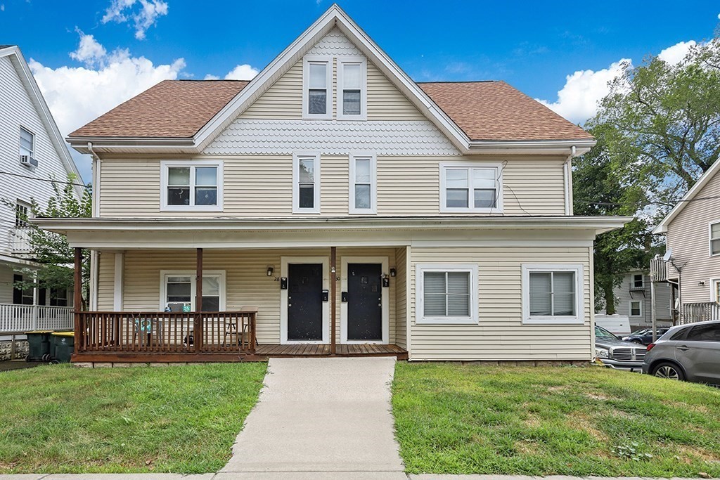 28-30 Alpine Place Franklin, MA 02038 - Photo 1 of 21 a front view of a house with a yard