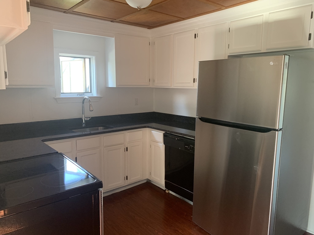 28-30 Alpine Place Franklin, MA 02038 - Photo 12 of 21 a kitchen with a refrigerator and a sink
