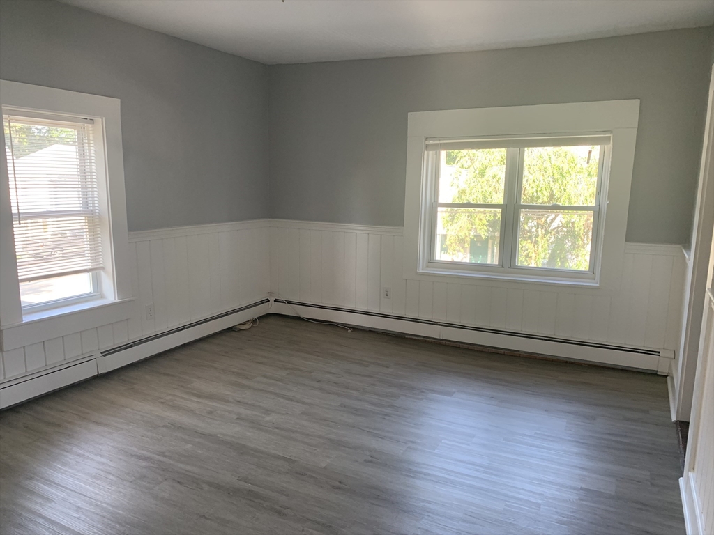 28-30 Alpine Place Franklin, MA 02038 - Photo 18 of 21 an empty room with wooden floor and windows