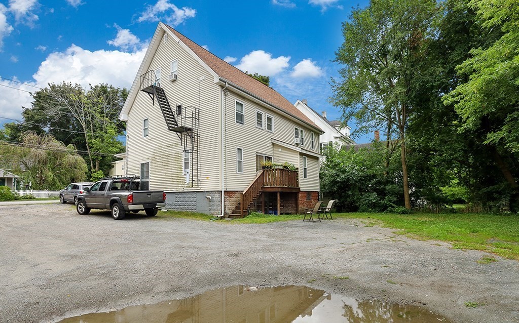 28-30 Alpine Place Franklin, MA 02038 - Photo 4 of 21 a view of house with a big yard and large trees