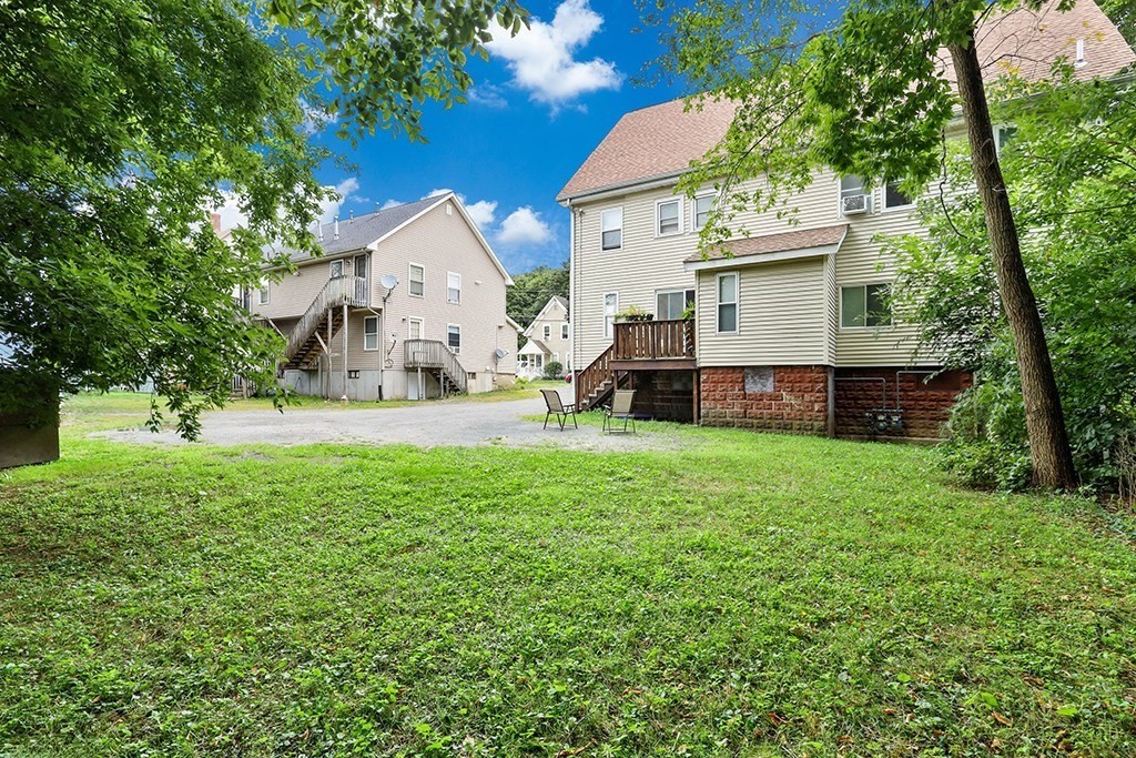 28-30 Alpine Place Franklin, MA 02038 - Photo 7 of 21 a front view of a house with garden