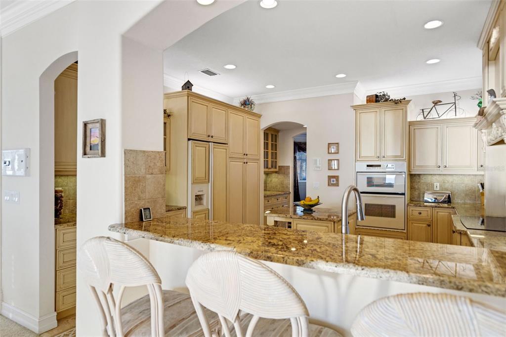 13423 Gulf Lane Madeira Beach, FL 33708 - Photo 16 of 71 a large bedroom with a bed and a view of living room