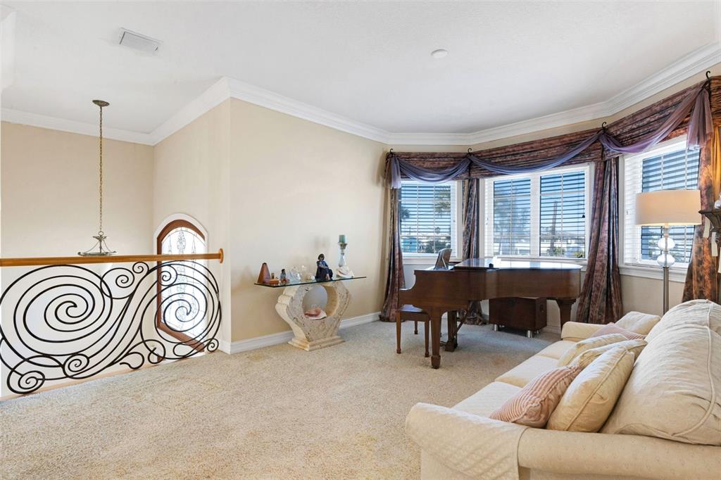 13423 Gulf Lane Madeira Beach, FL 33708 - Photo 20 of 71 a bedroom with furniture and a large window