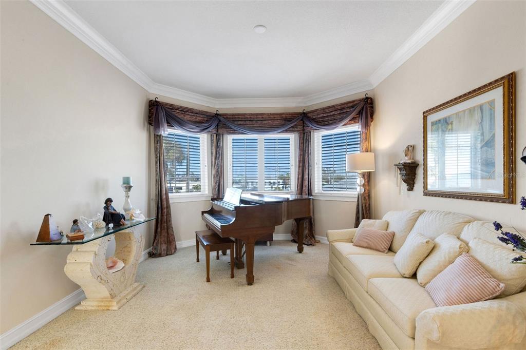 13423 Gulf Lane Madeira Beach, FL 33708 - Photo 21 of 71 a living room with furniture and a large window