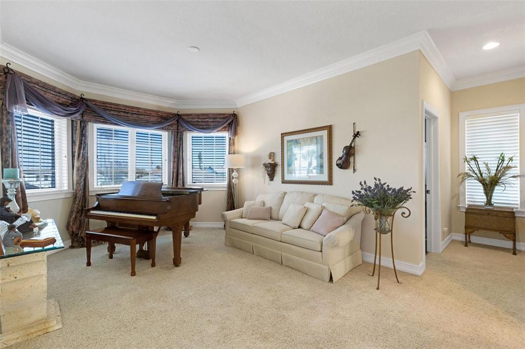 13423 Gulf Lane Madeira Beach, FL 33708 - Photo 22 of 71 a living room with furniture and a potted plant