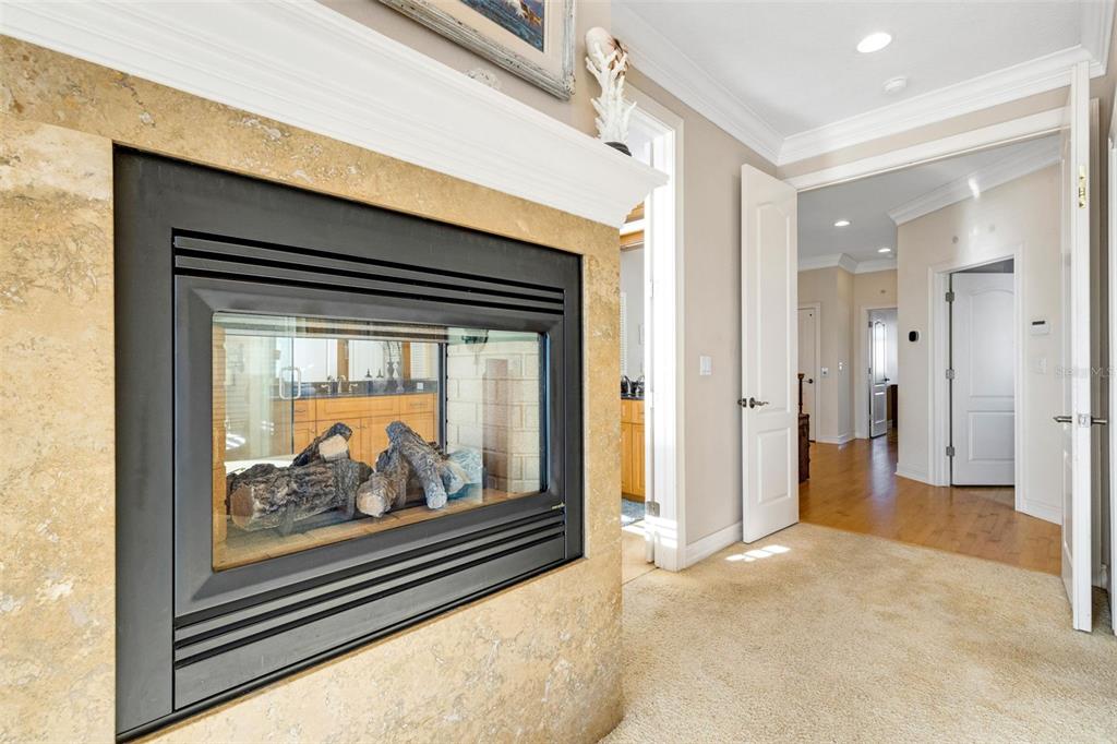 13423 Gulf Lane Madeira Beach, FL 33708 - Photo 41 of 71 a view of a hallway with wooden floor and a fireplace