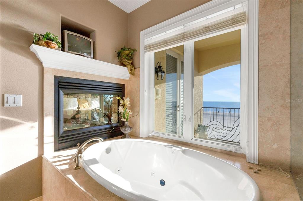 13423 Gulf Lane Madeira Beach, FL 33708 - Photo 42 of 71 a bathroom with a bathtub and shower