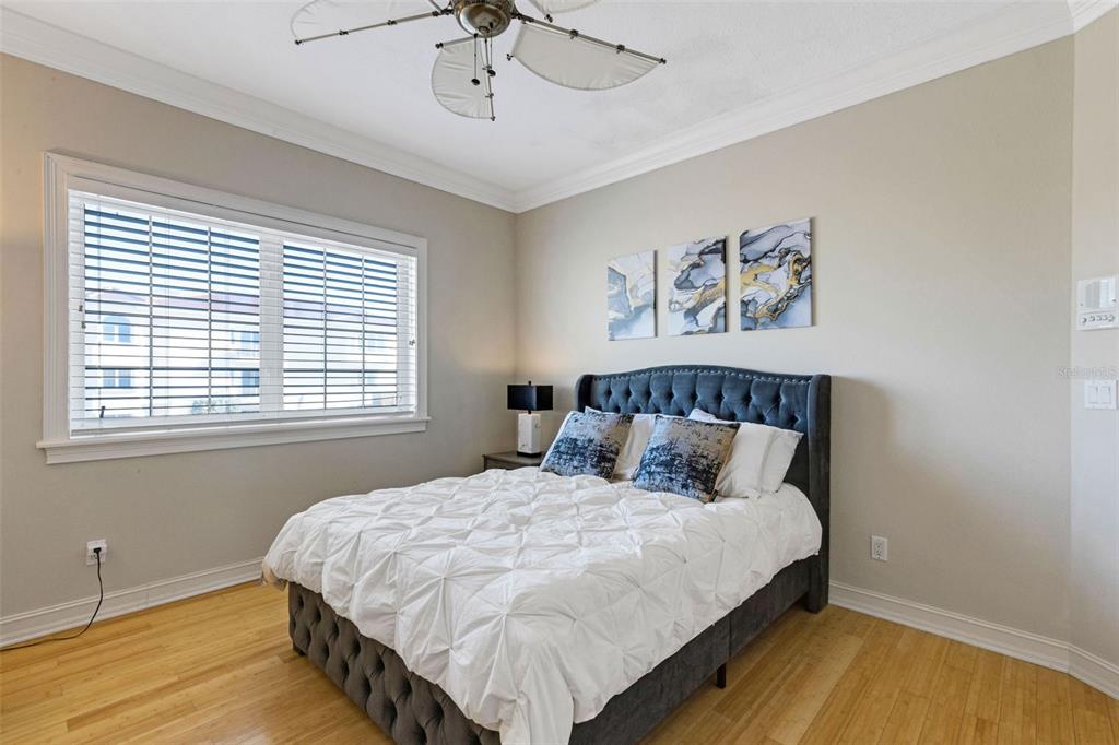 13423 Gulf Lane Madeira Beach, FL 33708 - Photo 45 of 71 a large bed sitting in a bedroom next to a window