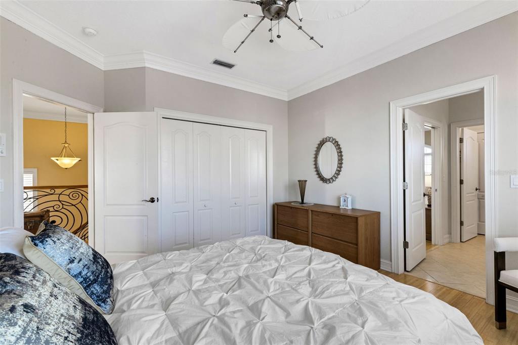 13423 Gulf Lane Madeira Beach, FL 33708 - Photo 47 of 71 a bedroom with a bed and wooden floor