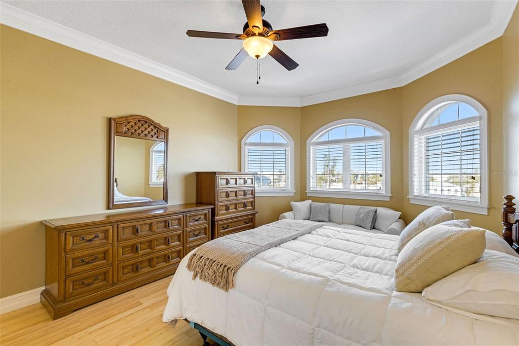 13423 Gulf Lane Madeira Beach, FL 33708 - Photo 53 of 71 a bedroom with a bed and a dresser