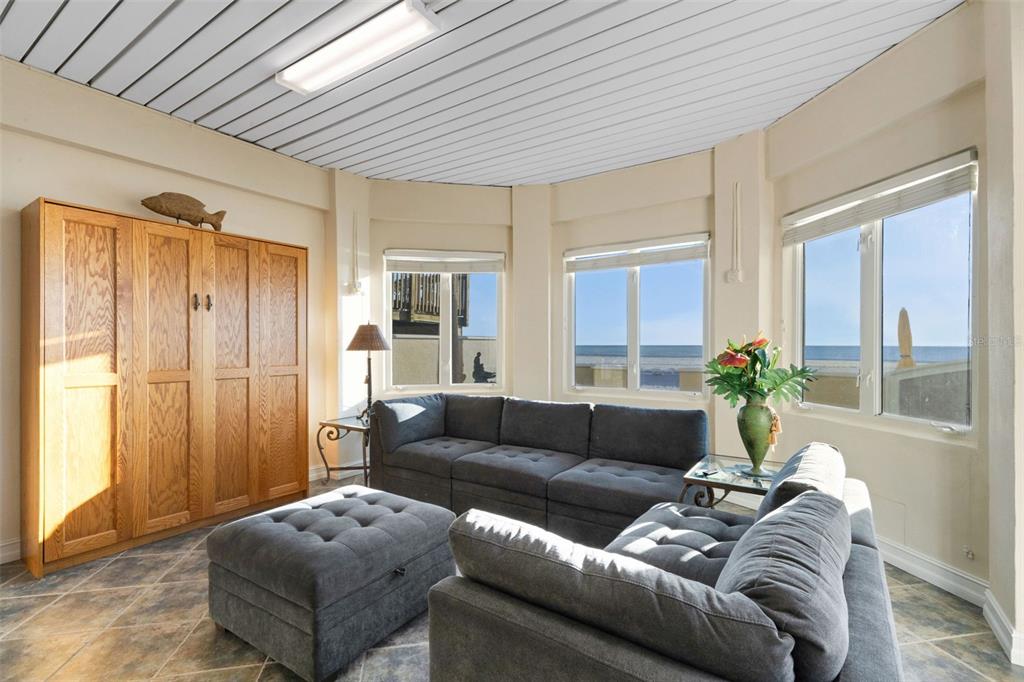 13423 Gulf Lane Madeira Beach, FL 33708 - Photo 59 of 71 a living room with furniture and a large window