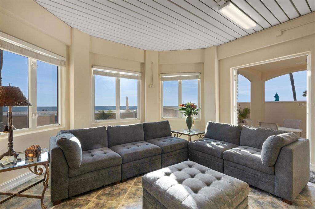 13423 Gulf Lane Madeira Beach, FL 33708 - Photo 60 of 71 a living room with furniture and a large window