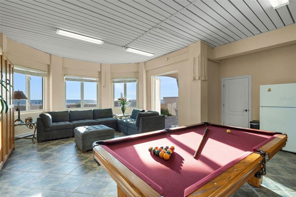 13423 Gulf Lane Madeira Beach, FL 33708 - Photo 61 of 71 a living room with furniture and a table