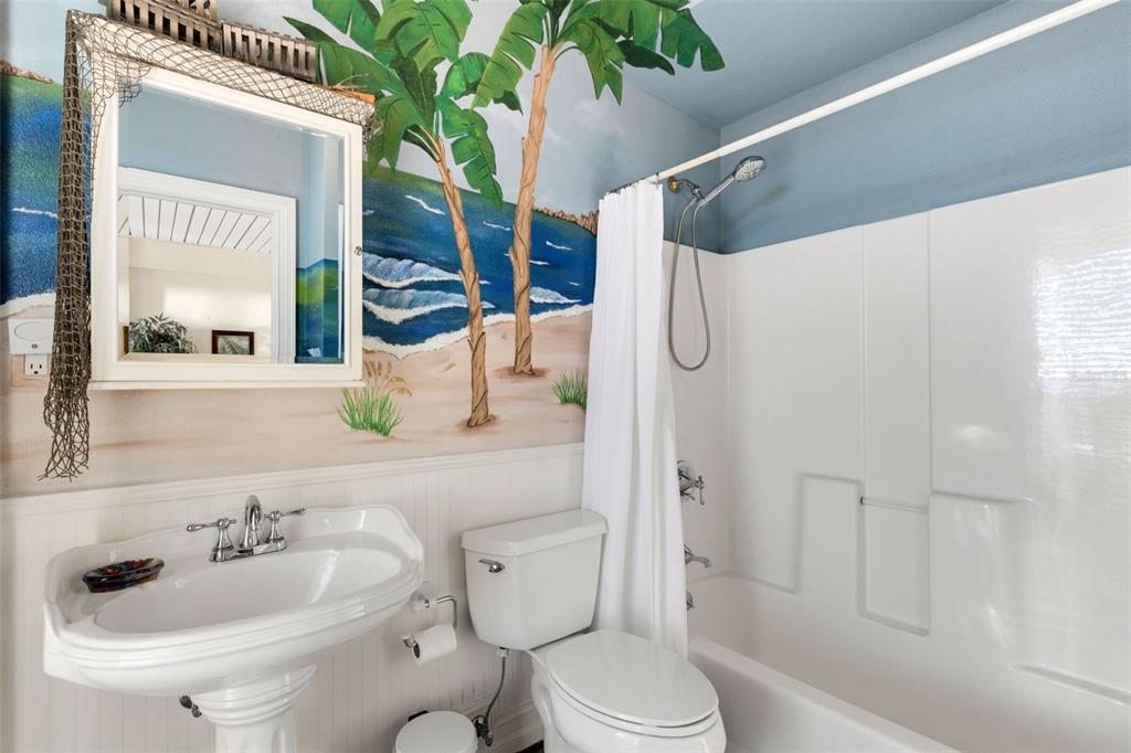 13423 Gulf Lane Madeira Beach, FL 33708 - Photo 65 of 71 a bathroom with a sink a toilet and shower