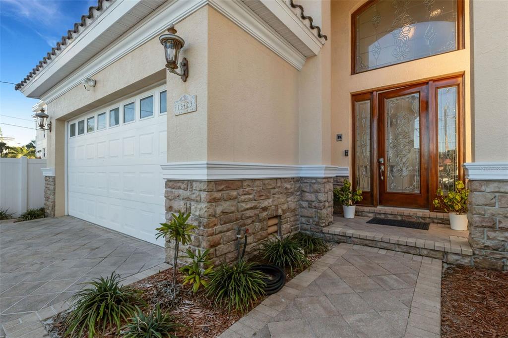 13423 Gulf Lane Madeira Beach, FL 33708 - Photo 66 of 71 a front view of a house with a yard