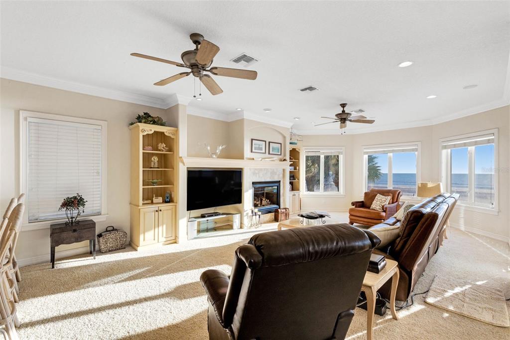 13423 Gulf Lane Madeira Beach, FL 33708 - Photo 8 of 71 a living room with furniture a ceiling fan and a flat screen tv