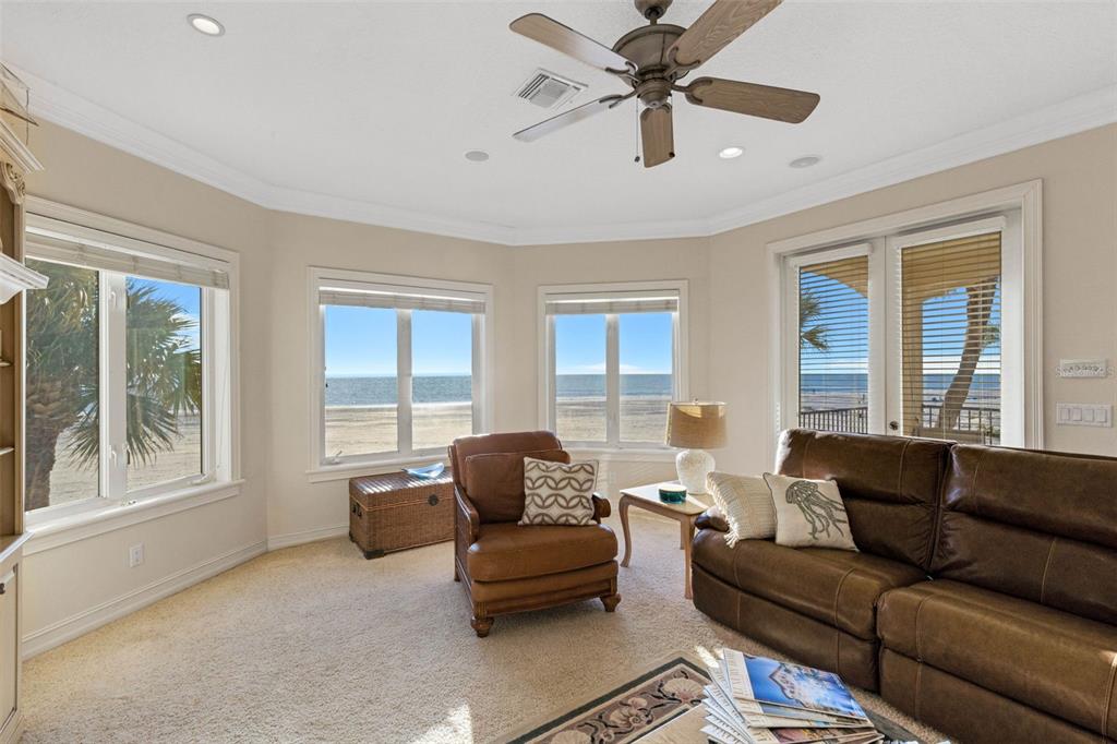 13423 Gulf Lane Madeira Beach, FL 33708 - Photo 9 of 71 a living room with furniture and a large window