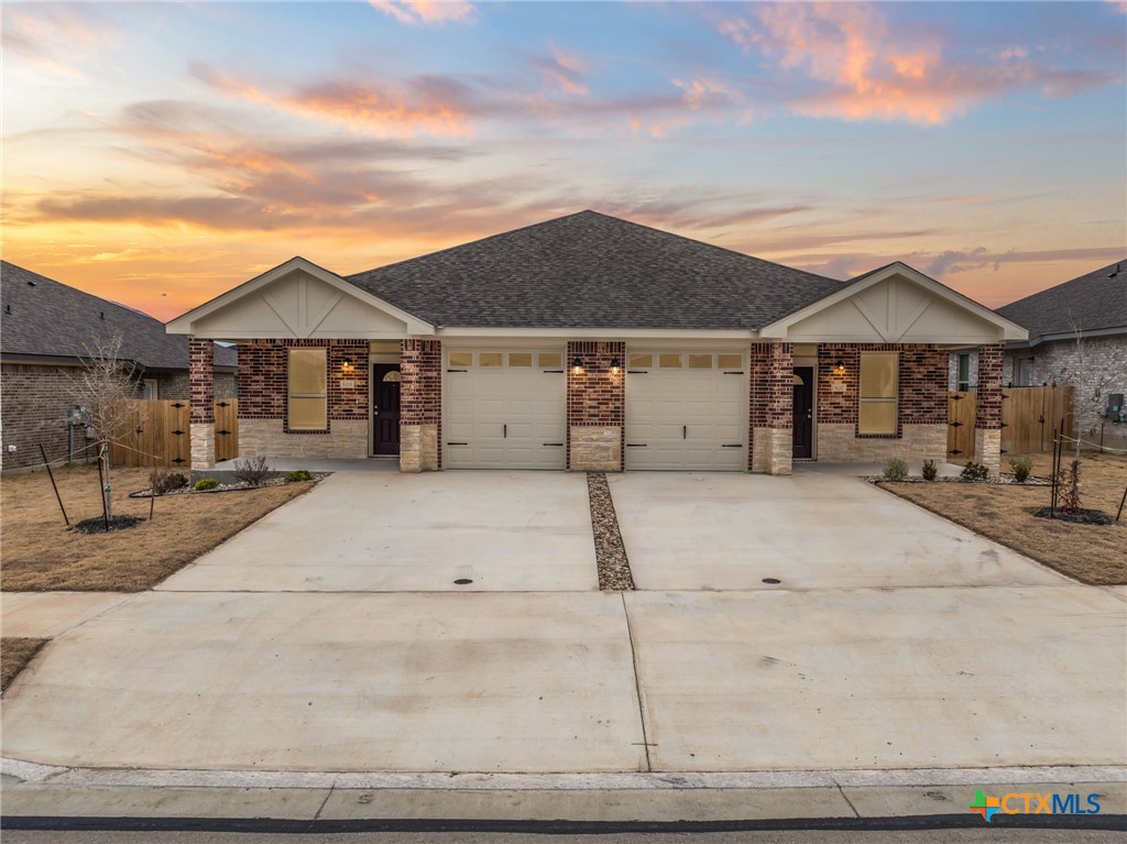 5217 Rose Gdn Loop Killeen, TX 76542 - Photo 1 of 21 a house with a bench in front of it