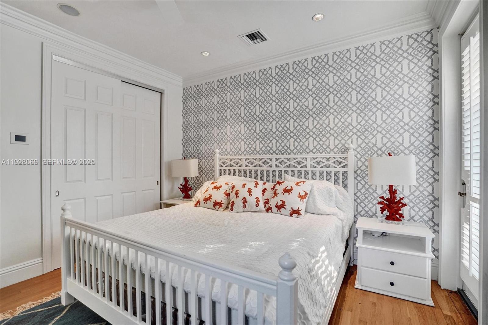 1281 Banyan Road Boca Raton, FL 33432 - Photo 52 of 69 a bedroom with a bed and a dresser