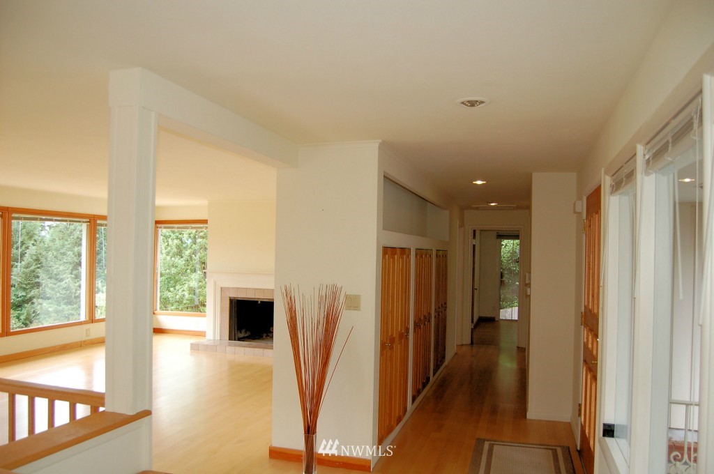 504 Briar Road Bellingham, WA 98225 - Photo 16 of 25 a view of a hallway with wooden floor and staircase