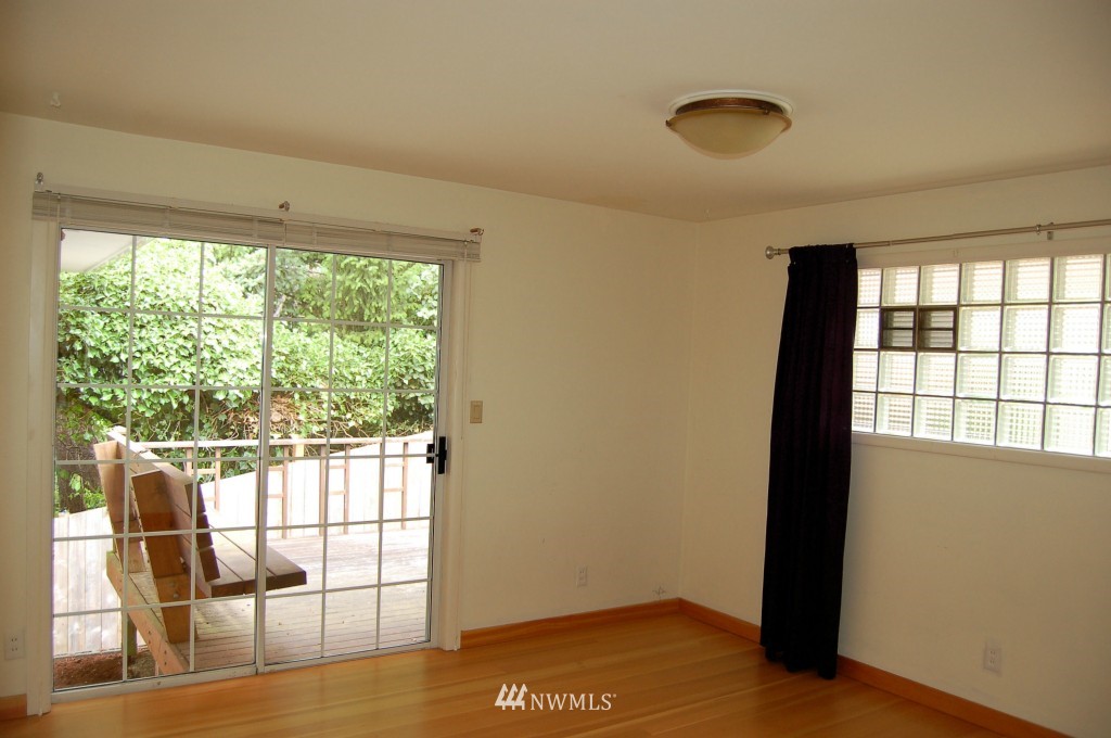 504 Briar Road Bellingham, WA 98225 - Photo 22 of 25 a view of a room with wooden floor and windows