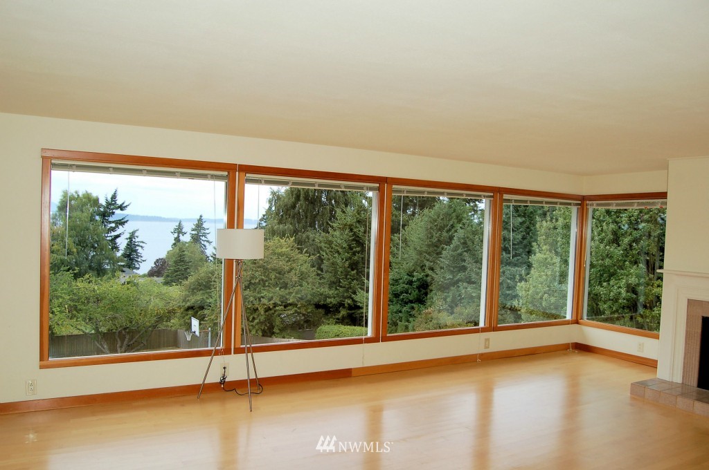 504 Briar Road Bellingham, WA 98225 - Photo 10 of 25 a view of an empty room with wooden floor and a window