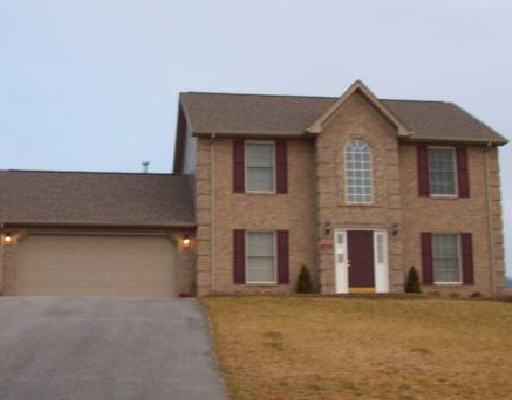 a front view of a house with a garage