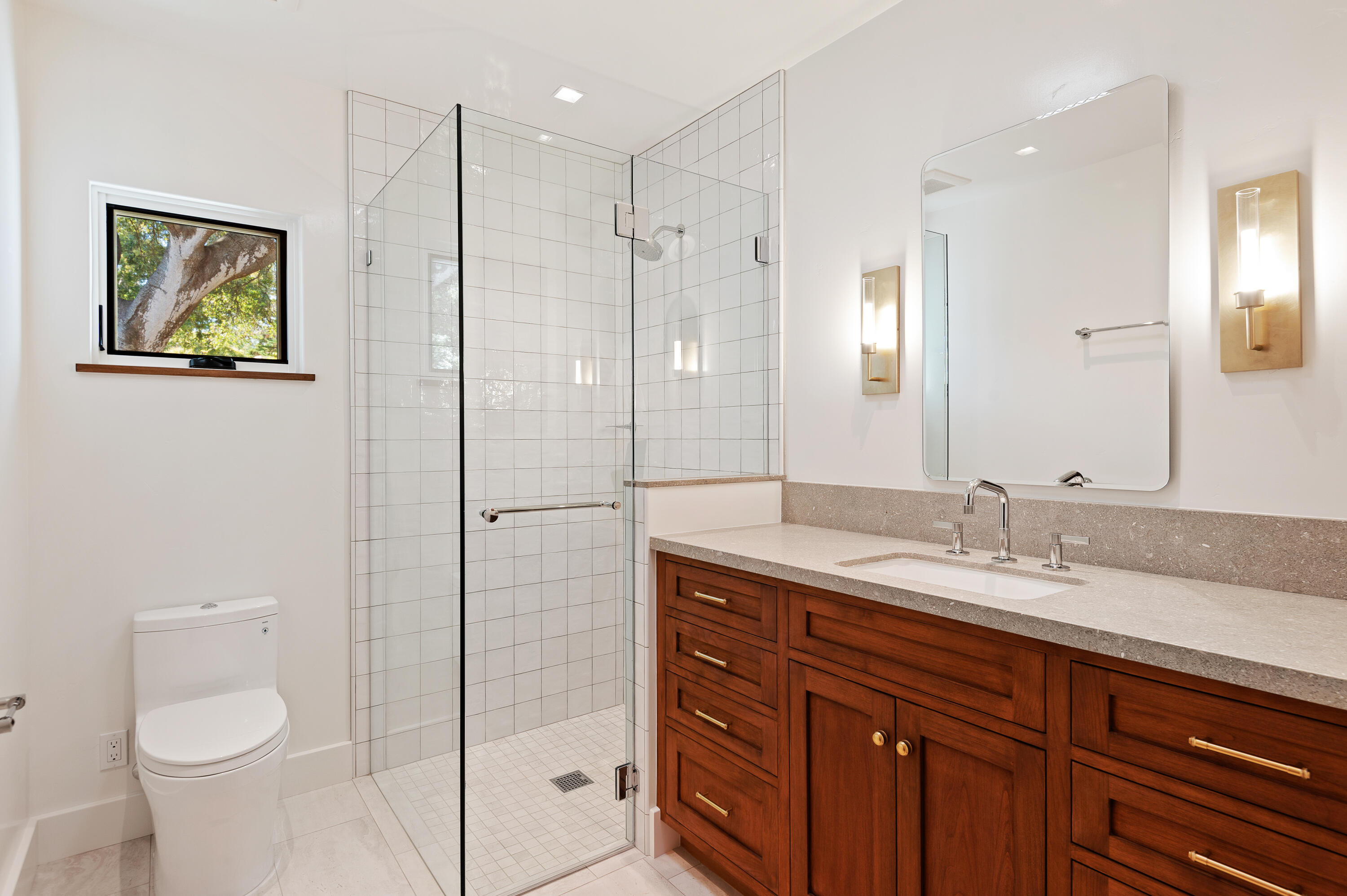 427 Pimiento Lane Montecito, CA 93108 - Photo 18 of 22 a bathroom with a granite countertop sink a toilet and a shower