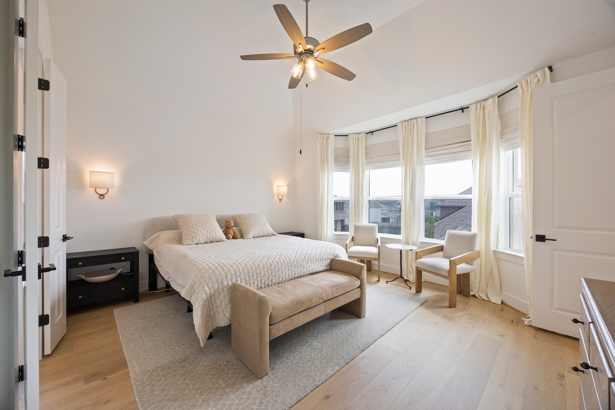 1204 Addison Lane Georgetown, TX 78628 - Photo 12 of 35 The suite is designed with custom sconce lighting and a bay window that floods the room with natural light, offering a perfect spot for a morning coffee.