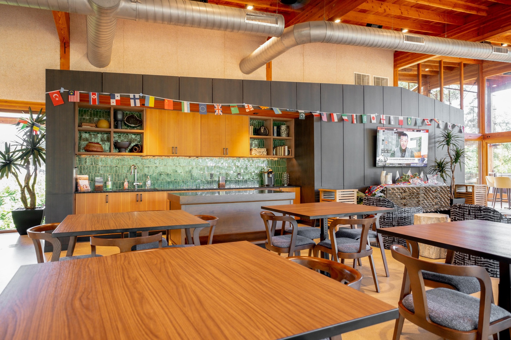 1204 Addison Lane Georgetown, TX 78628 - Photo 29 of 35 The community’s social hub features a sophisticated interior with vaulted wood ceilings and a catering kitchen with a vibrant green tile backsplash.