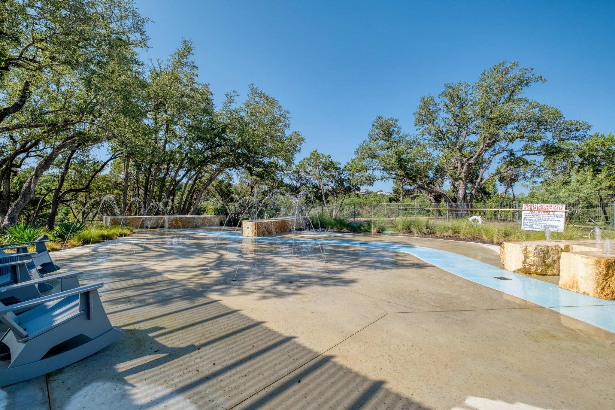 1204 Addison Lane Georgetown, TX 78628 - Photo 31 of 35 Designed for all ages, the community includes a modern splash pad integrated into the natural landscape. With stone block seating and playful water jets, it’s a perfect destination for summer fun just steps from your front door.