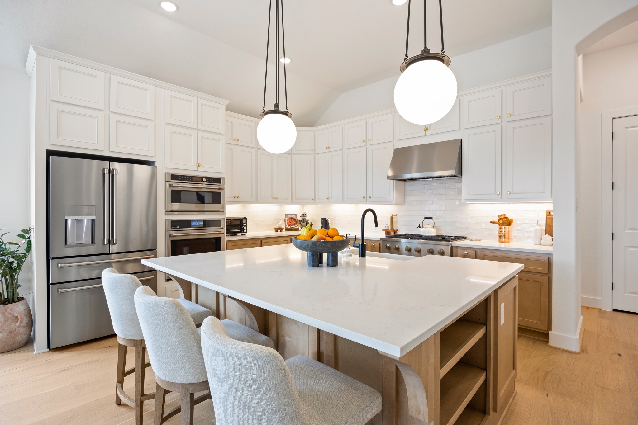 1204 Addison Lane Georgetown, TX 78628 - Photo 3 of 35 Upgrades include an added spice rack, cutting board cabinet, pots and pans drawer, garbage pull out, corner lazy Susan.