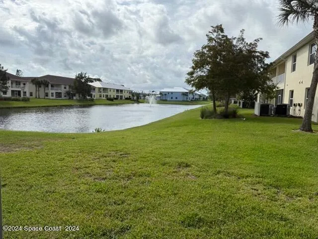 a view of a lake with houses in the background