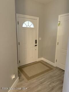 917 Ocaso Lane Rockledge, FL 32955 - Photo 20 of 22 an empty room with wooden floor and closet