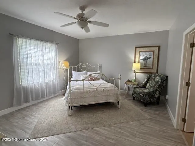 a bedroom with furniture and a chandelier