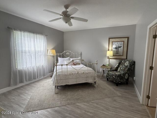917 Ocaso Lane Rockledge, FL 32955 - Photo 7 of 22 a bedroom with furniture and a chandelier