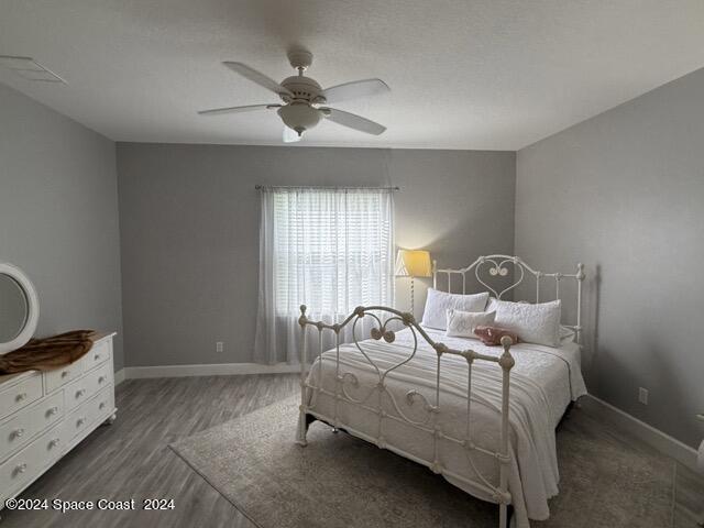 917 Ocaso Lane Rockledge, FL 32955 - Photo 8 of 22 a bedroom with a bed and window